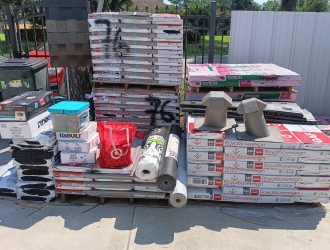 Stacked roofing supplies outside